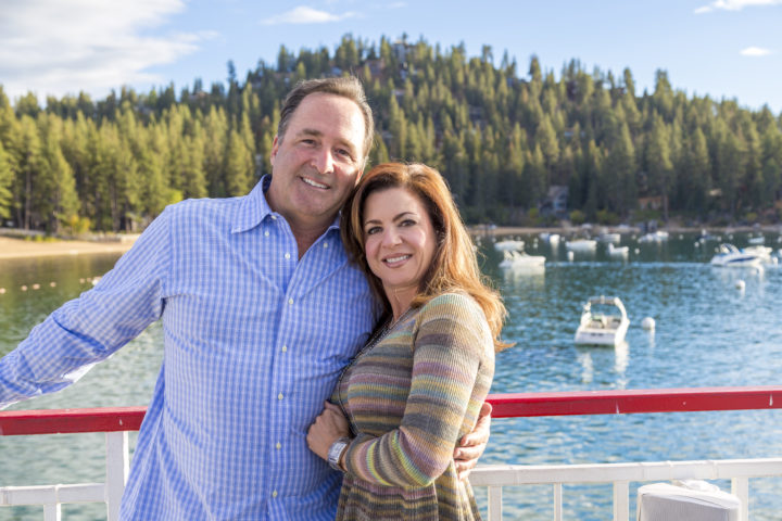 Man and woman smiling on a boat