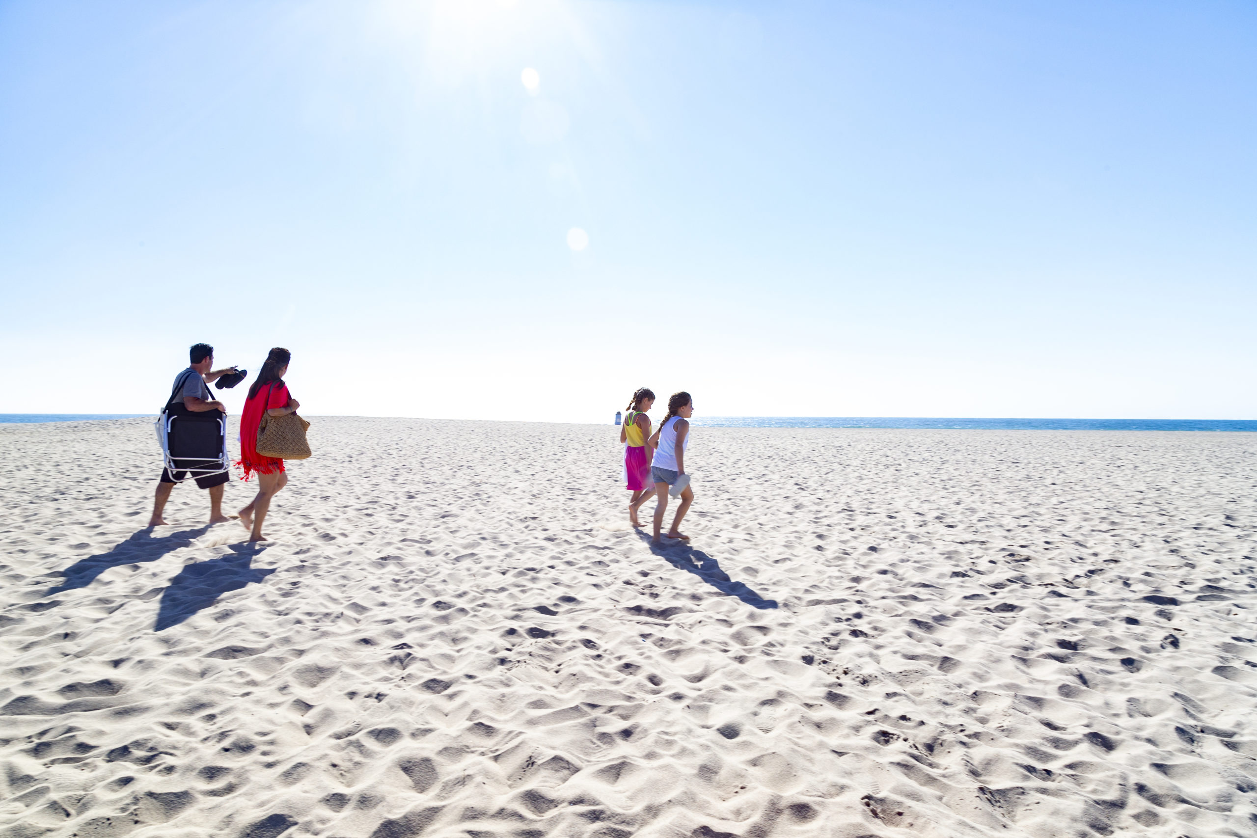 Family walking on the beach